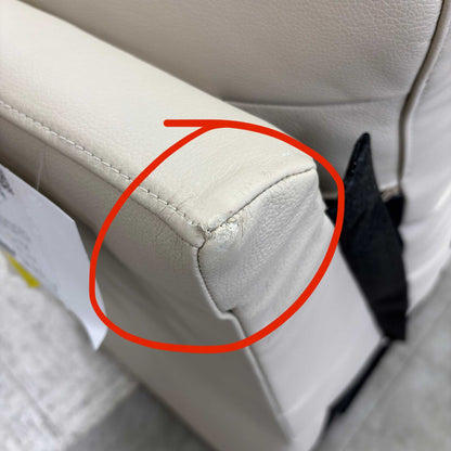 Detail shot of the armrest, showing the damage upholstery area in close up.