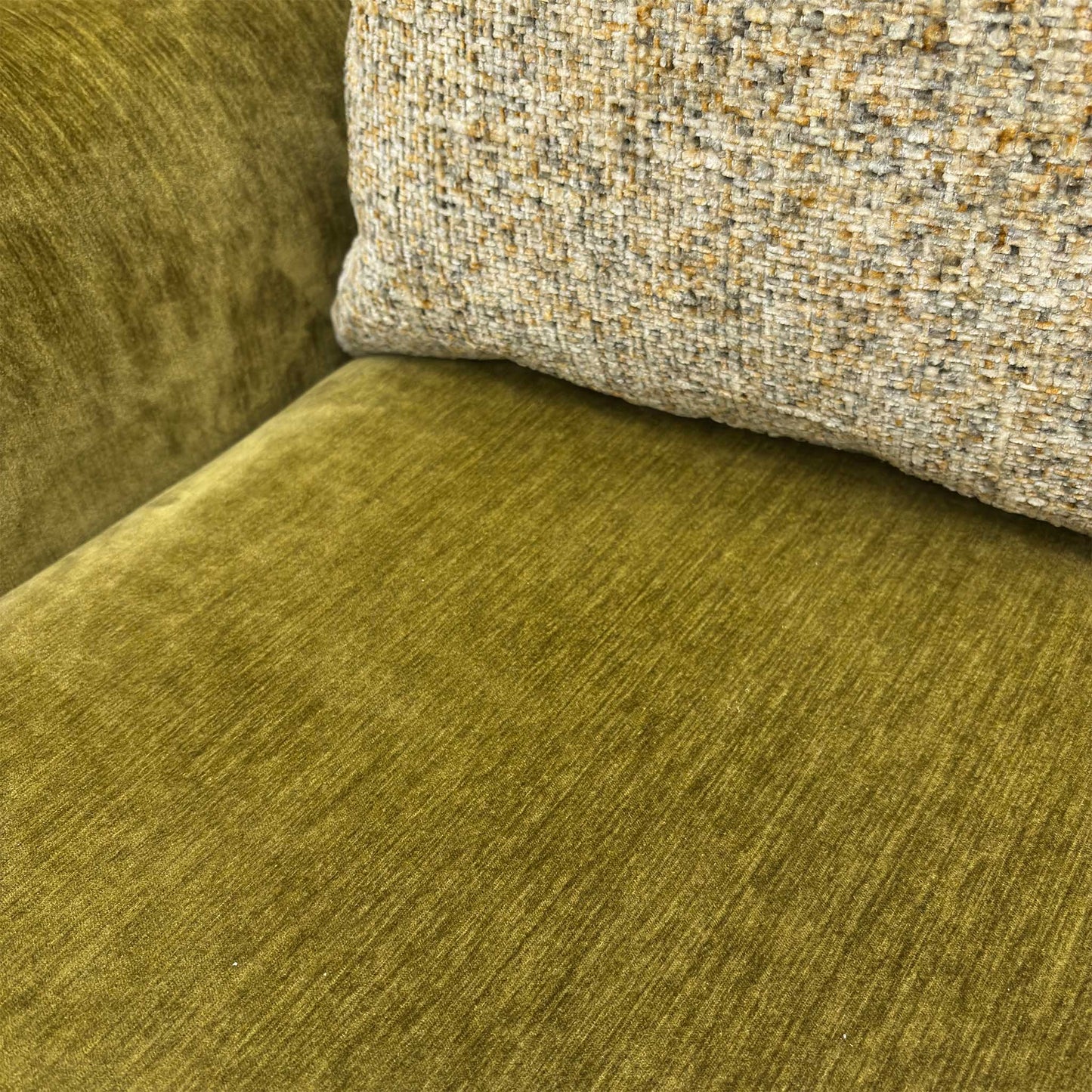 Close-up of the sturdy frame and durable upholstery of the Jackson chenille sofa.