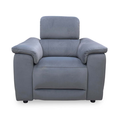 Front view of the ‘Genius’ power recliner chair in Bella Iron Grey 43460 velvet, featuring a modern high-back design, padded armrests, and integrated tech features.