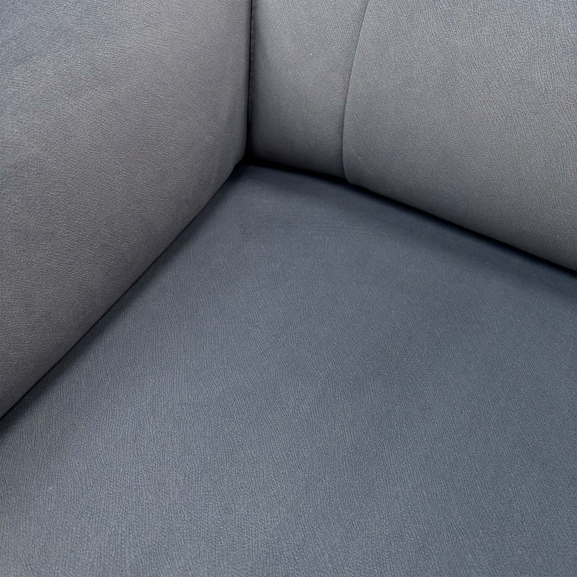 Close-up of the Bella Iron Grey 43460 velvet fabric, highlighting the premium soft-touch finish, rich grey tone, and high-quality tailored stitching.