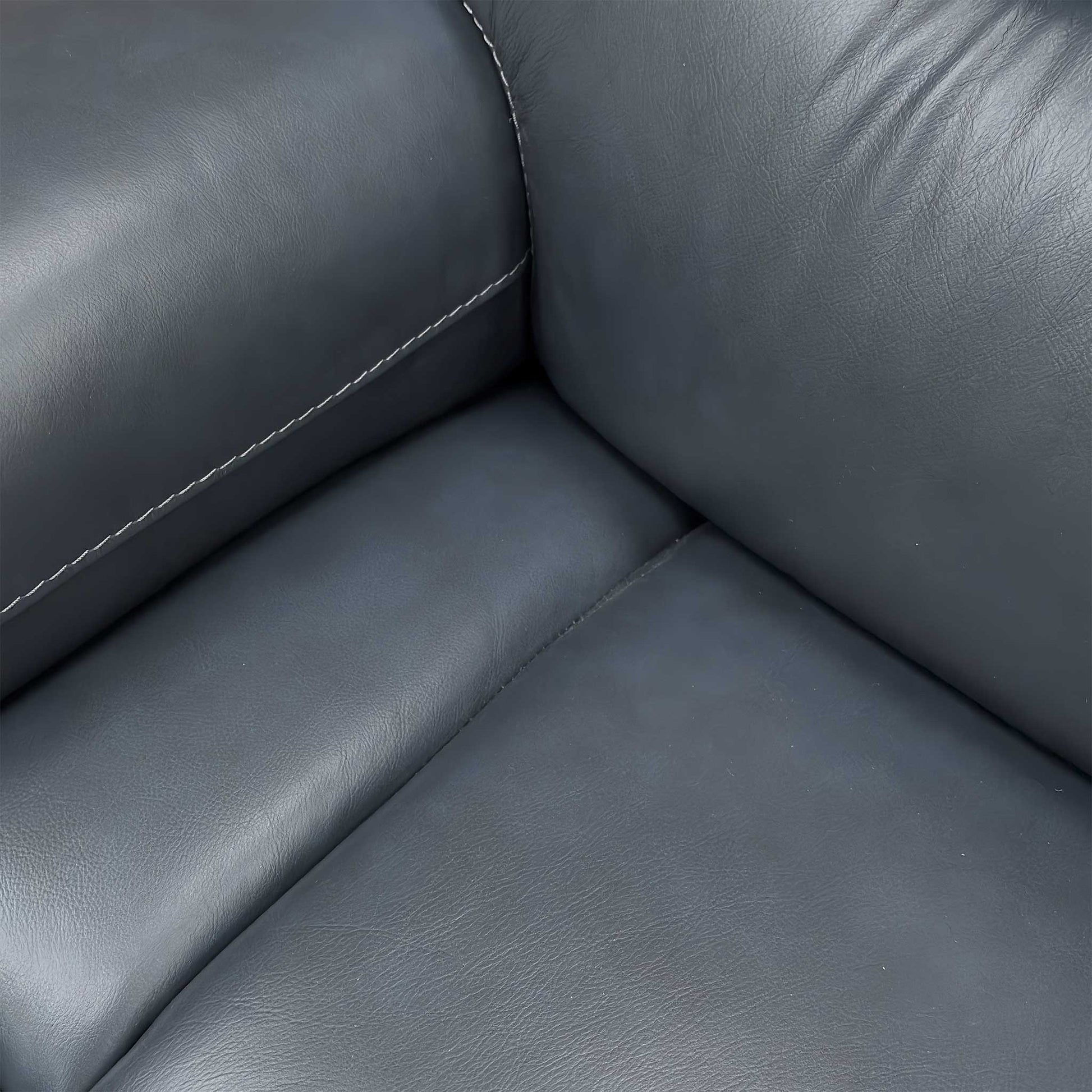 Close-up of the Natural Milled Navy LA 4828 leather, highlighting the premium pebbled texture, deep navy color, and expert tonal stitching.