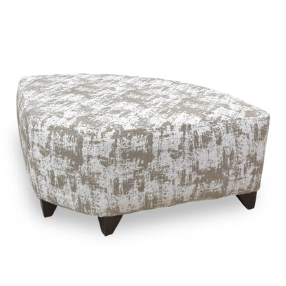 Side profile of the Aura wedge footstool, emphasizing the clean contemporary lines and the tailored upholstery finish of the angled frame.