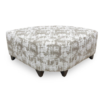 Side profile of the Aura wedge footstool, emphasizing the clean contemporary lines and the tailored upholstery finish of the angled frame.