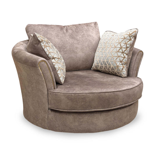 Full view of the ‘Mariah Ariana’ twister snuggler chair in Dapple Chocolate velvet, featuring a classic back design, elegant curved arms, and a stylish brass insert detail.