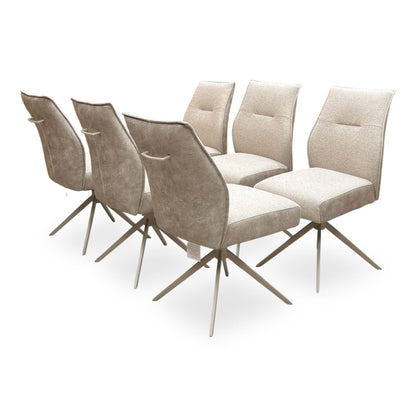 Full View set of 6 ‘Mirage’ swivel dining arm chairs in Neutral fabric, featuring a modern wrap-around bucket seat design and tapered black metal legs.