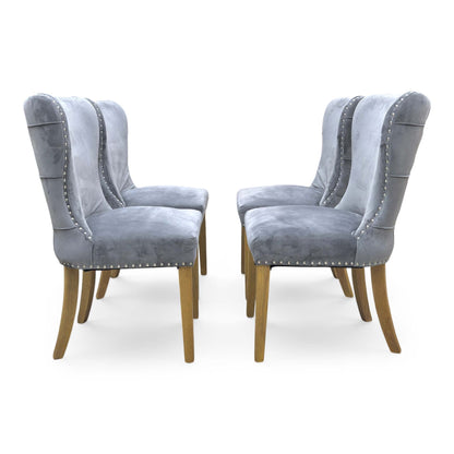 Front view of the Chennai chair, emphasizing the elegant roll-top design and the clean, seamless upholstery finish suitable for formal dining rooms.