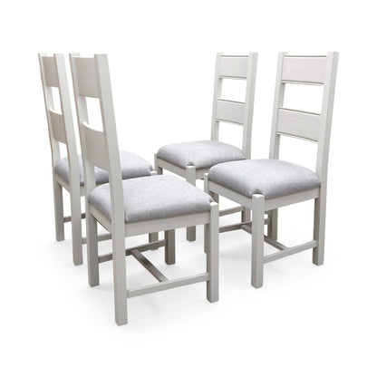 Full view of the Doune dining chairs, showing the contemporary grey fabric upholstered seat pads paired with a classic high-back wooden slat design.