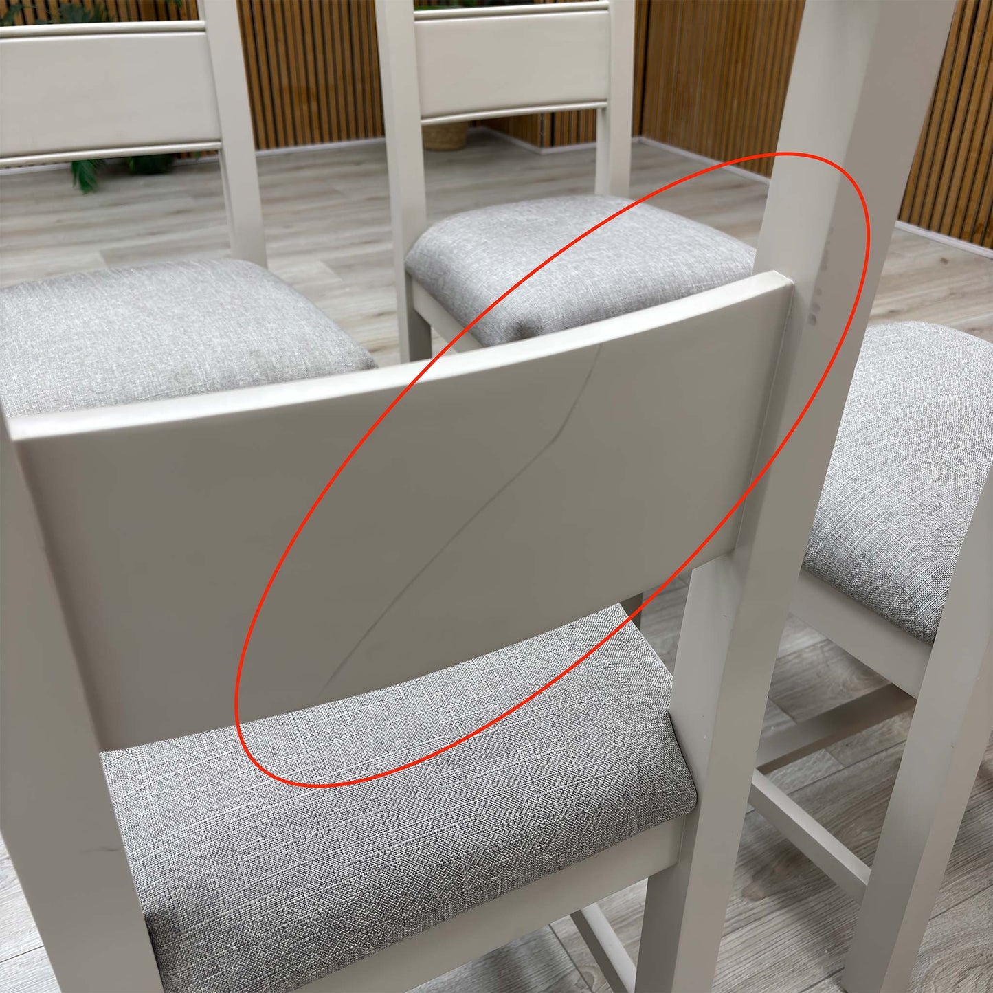 Detail shot focusing on the rear wood joints and slat back construction, demonstrating the high-quality craftsmanship and stability of the fixed frame.