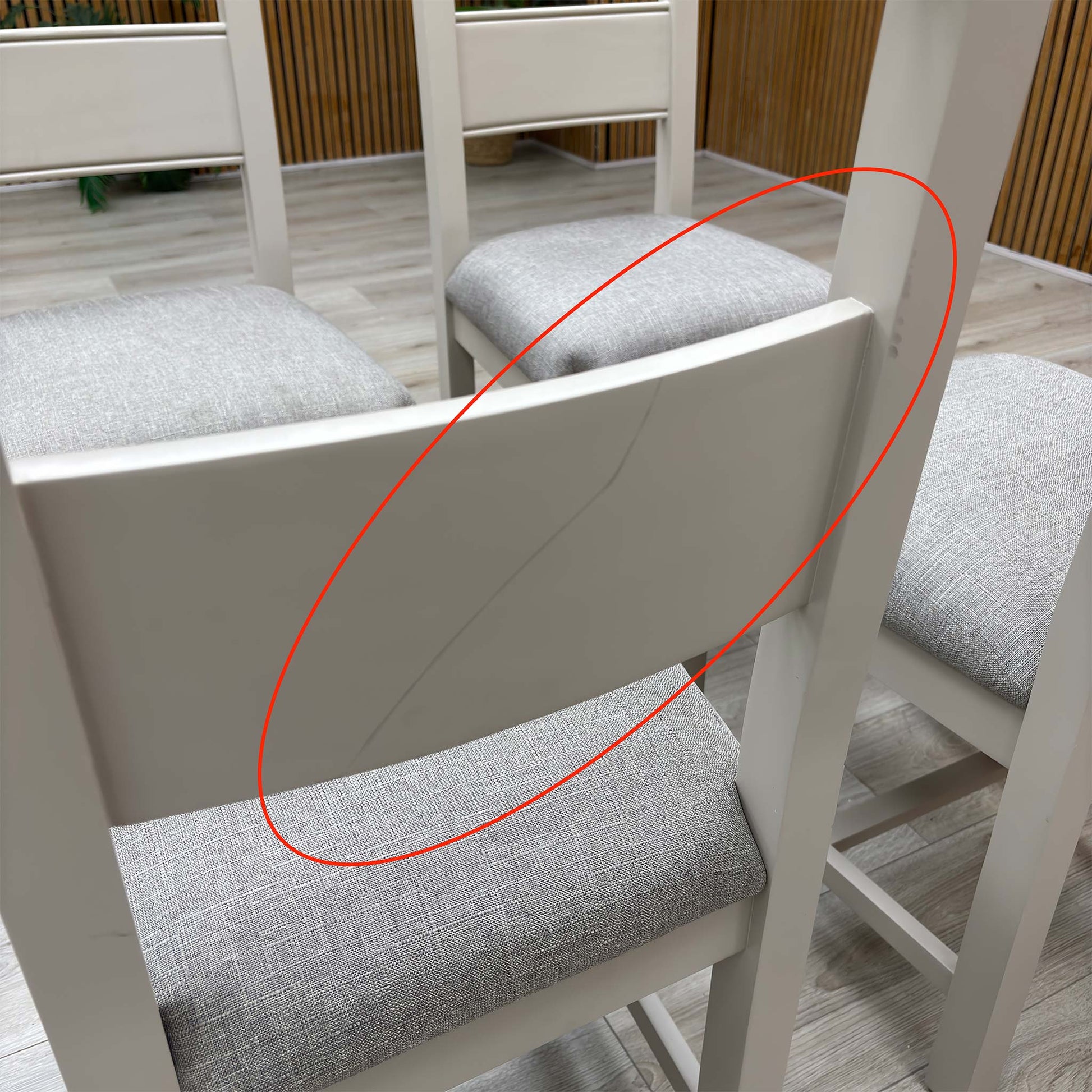 Detail shot focusing on the rear wood joints and slat back construction, demonstrating the high-quality craftsmanship and stability of the fixed frame.