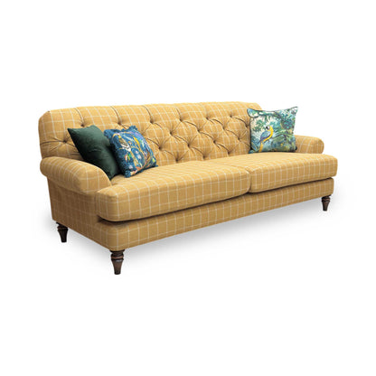 Full view of the ‘Canterbury’ 4-seater sofa in a traditional Ochre and Oatmeal check patterned fabric, featuring a classic deep-buttoned backrest and elegant scrolled arms.