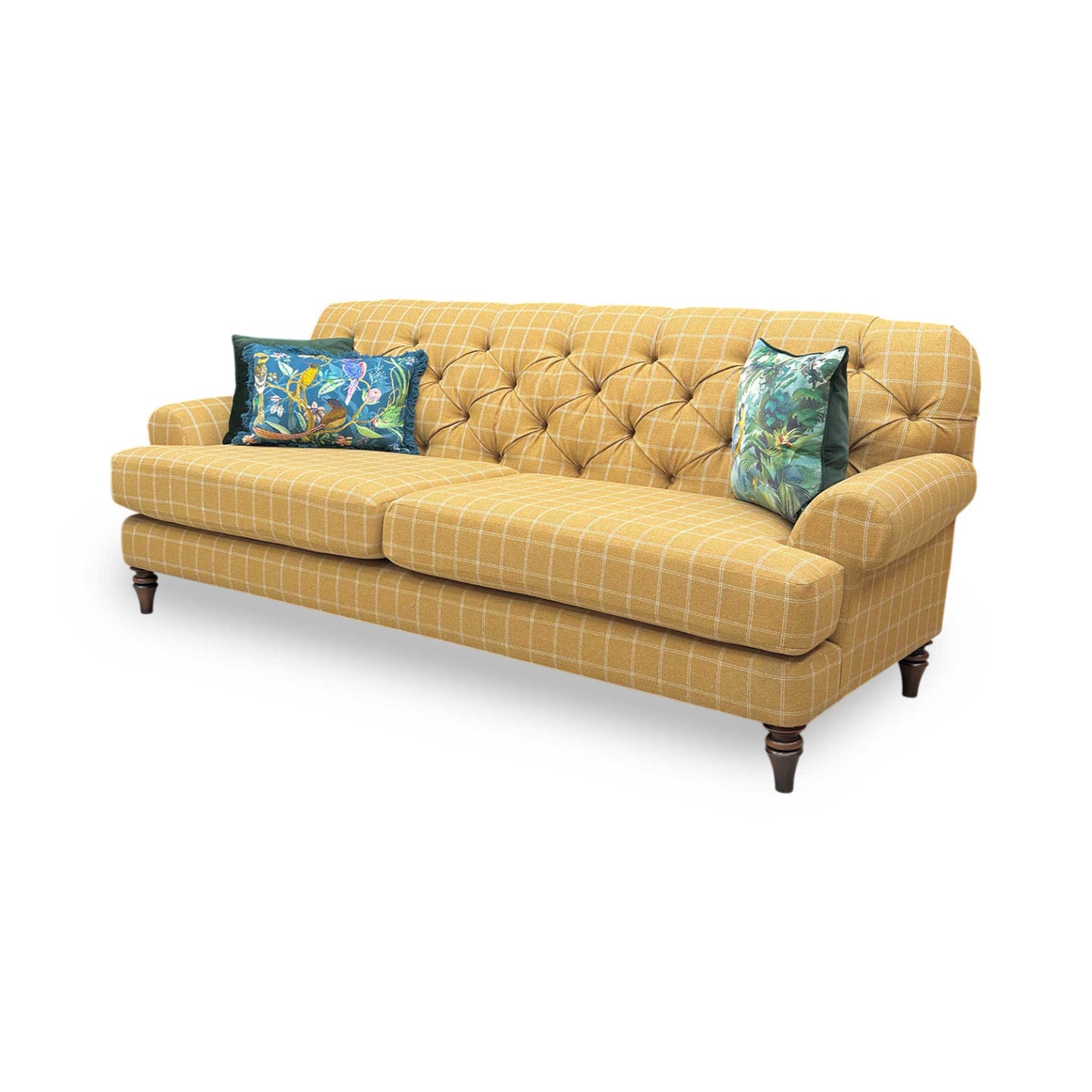 Side profile of the Canterbury sofa, emphasizing the graceful curve of the scrolled arms and the high-quality tailored finish of the patterned upholstery.