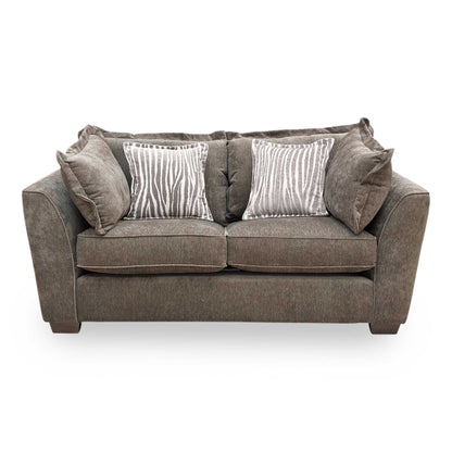 Front profile of the Finchley sofa, emphasizing the classic proportions and the graceful, supportive curve of the backrest and armrests.