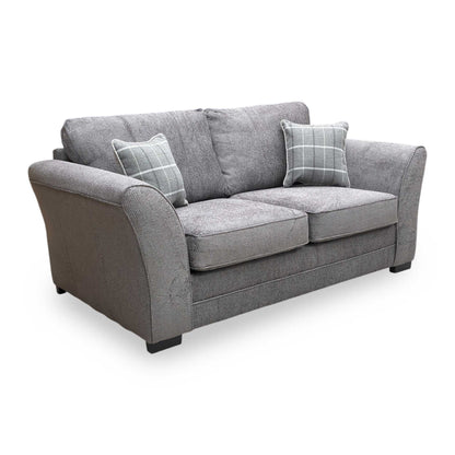 Side shot of the Sophie sofa bed fully extended into the bed position, emphasizing the supportive mattress area and the sturdy internal frame.