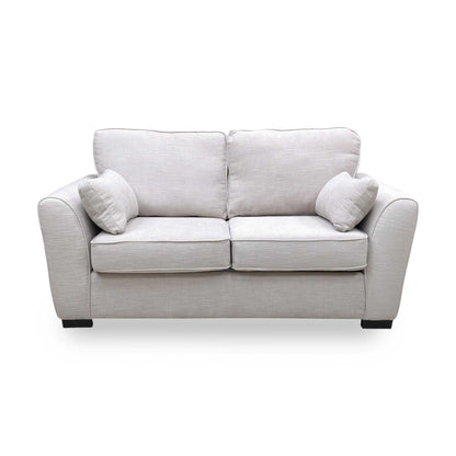 Front angle of the Roma sofa bed showing the depth of the cushions and the uniform grey linen finish.