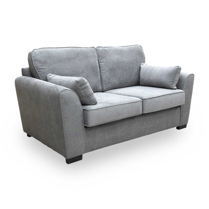 Side profile of the Roma grey linen sofa bed highlighting the sleek lines and compact footprint suitable for smaller rooms.