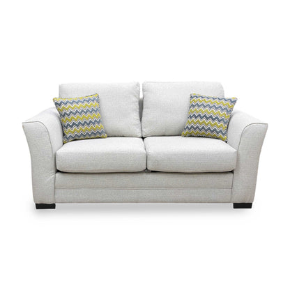 Front-on view of the Albany 2 seater sofa bed in cream woven fabric, highlighting the supportive back and flared armrests.