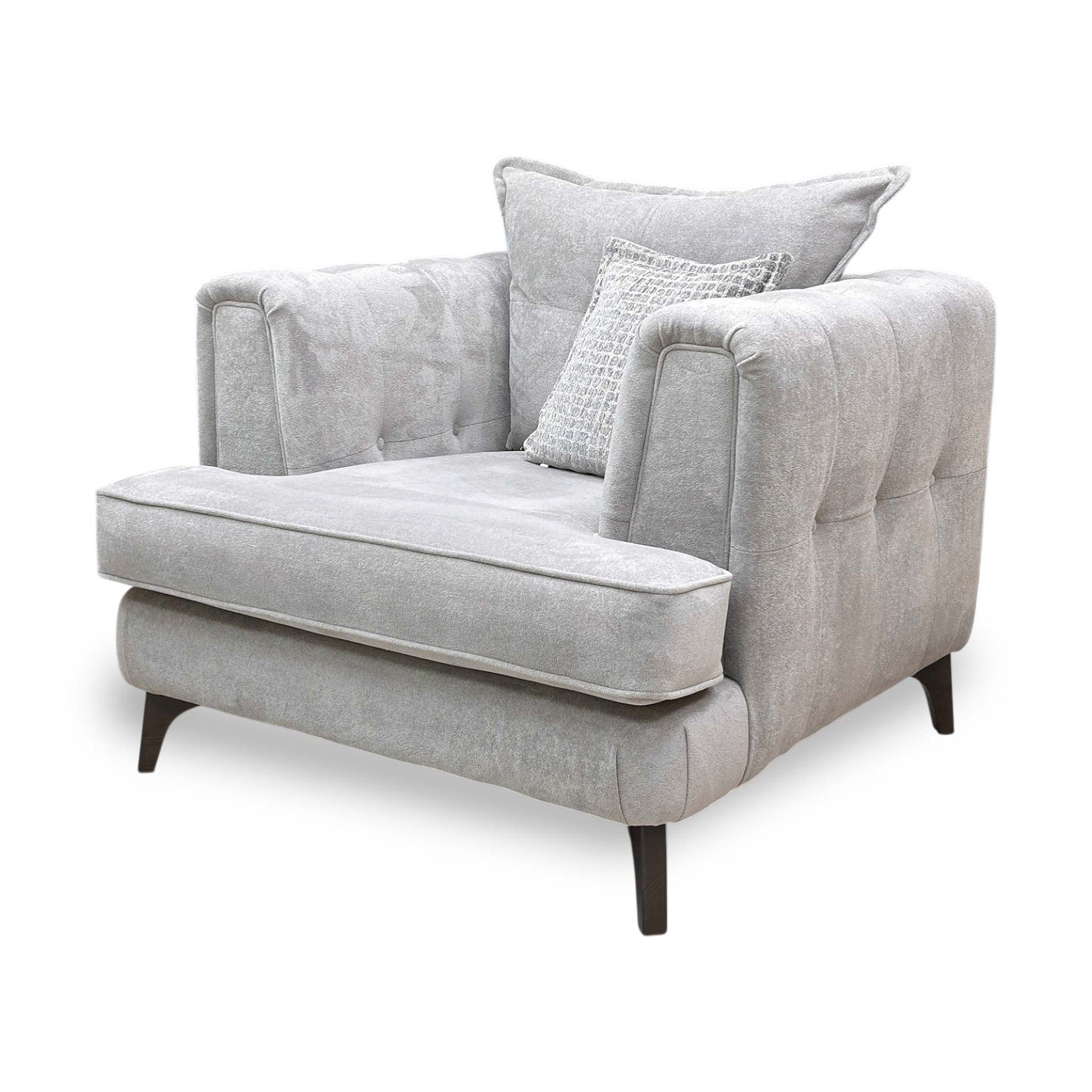 Side profile of the Farrah armchair, emphasizing the graceful angle of the backrest and the tailored finish of the silver fabric upholstery.