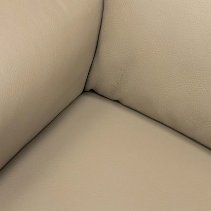 Extreme close-up of the Torello Taupe leather, illustrating the fine grain, rich color, and premium quality of the Nicoletti upholstery.