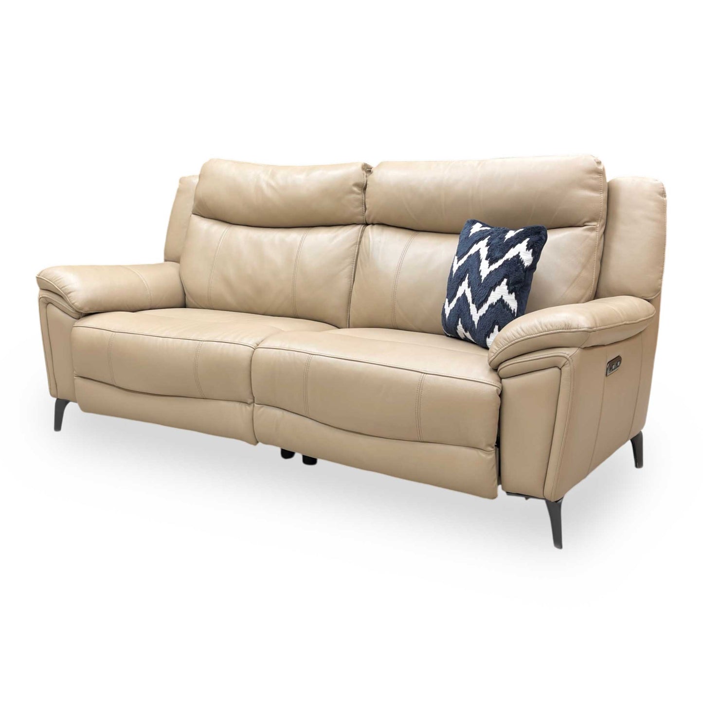 Side profile of the cream leather sofa, showing the modern open-base look and slender metal leg detail.