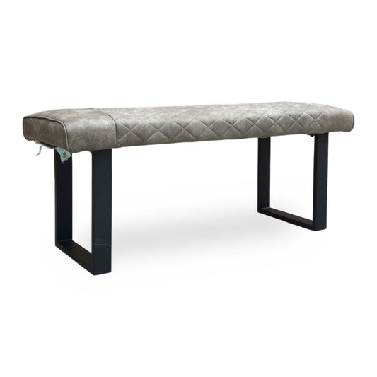 Full view of Modern Warrior dining bench upholstered in soft taupe fabric with elegant diamond quilted-effect stitching.