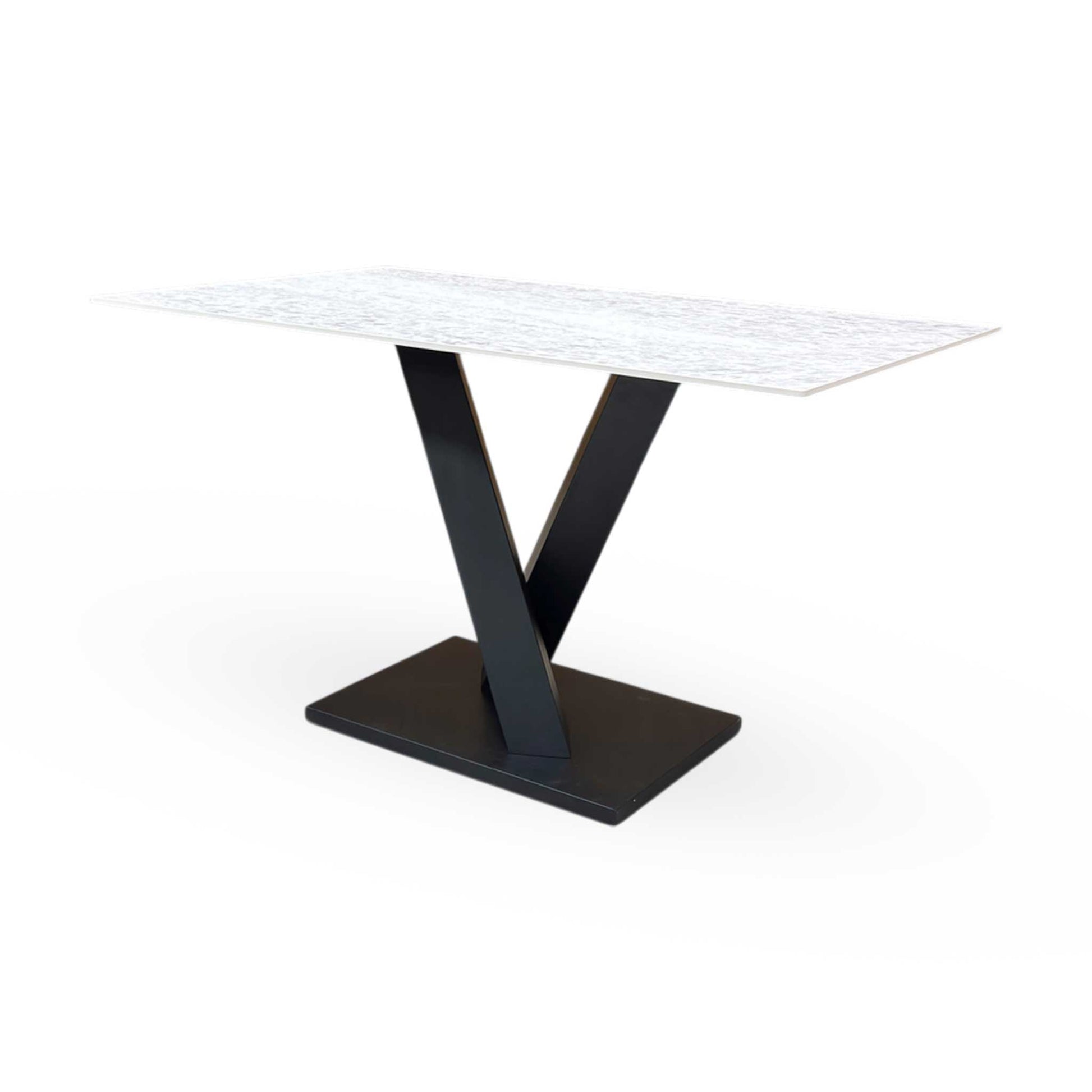 Angled view of the Warrior dining table, illustrating the smooth finish and generous seating capacity for up to 6 people.