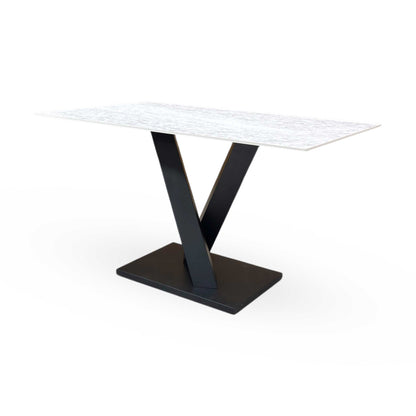 Angled view of the Warrior dining table, illustrating the smooth finish and generous seating capacity for up to 6 people.