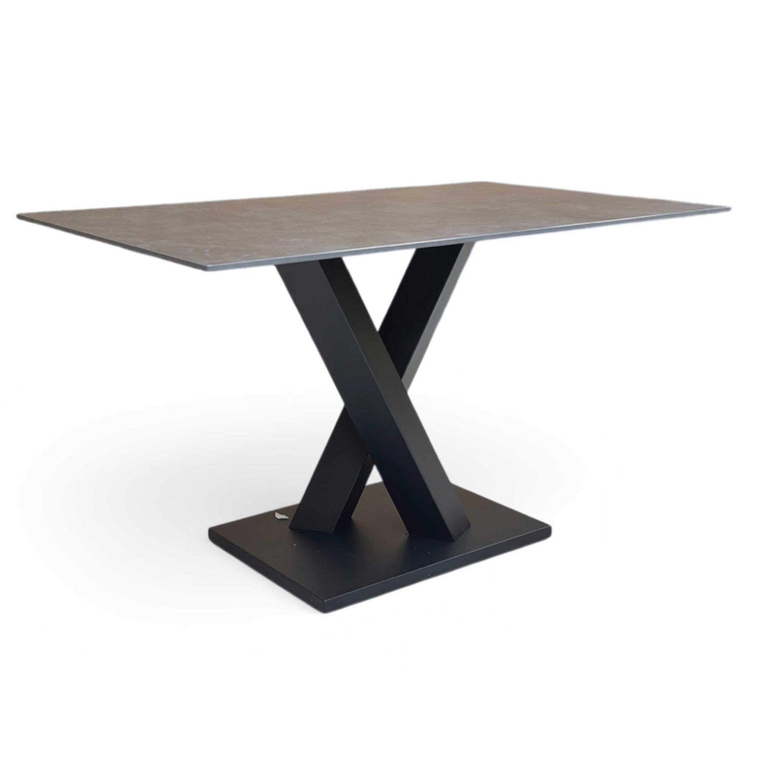 Full view of Compact 135cm Warrior dining table featuring a grey sintered stone ceramic top and a bold dark grey V-shaped metal base.