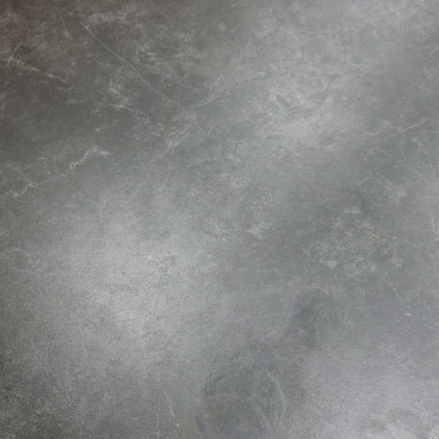 Macro shot of the sintered stone edge, illustrating the high-quality ceramic material and heat-resistant construction.