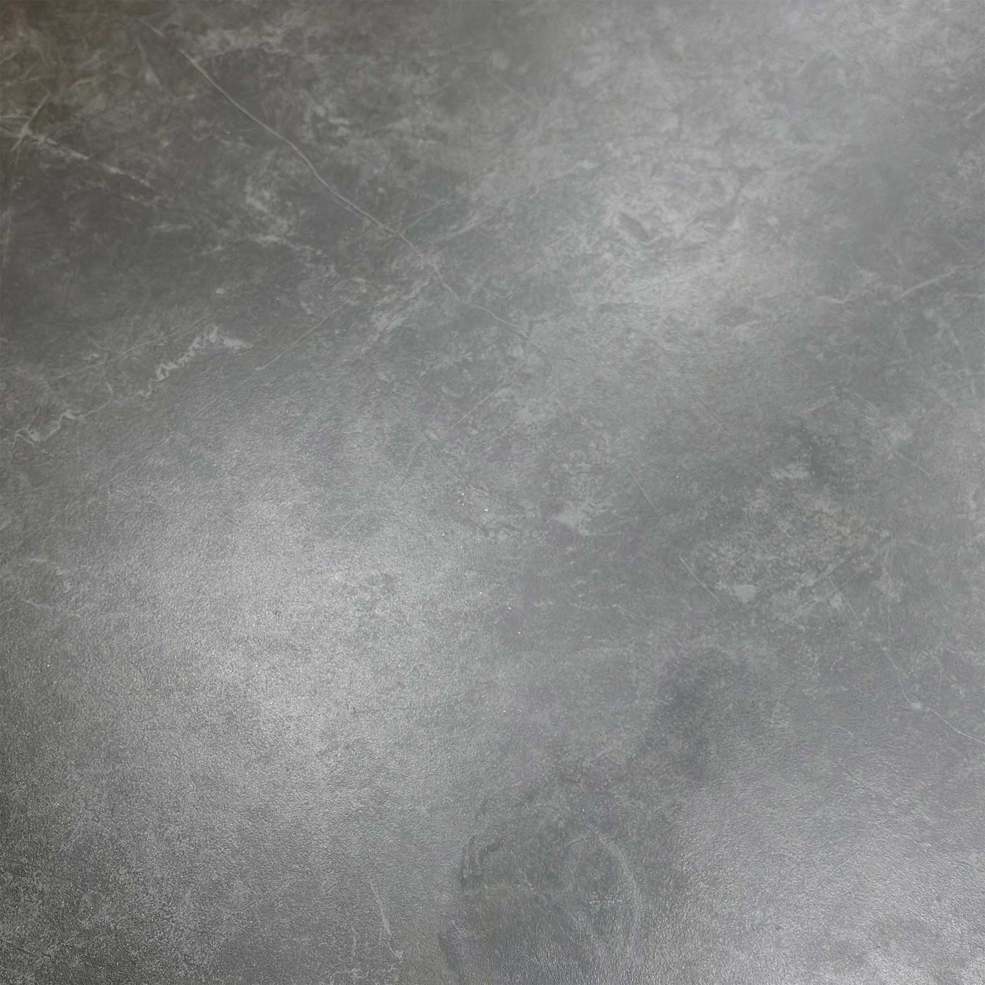 Macro shot of the sintered stone edge, illustrating the high-quality ceramic material and heat-resistant construction.