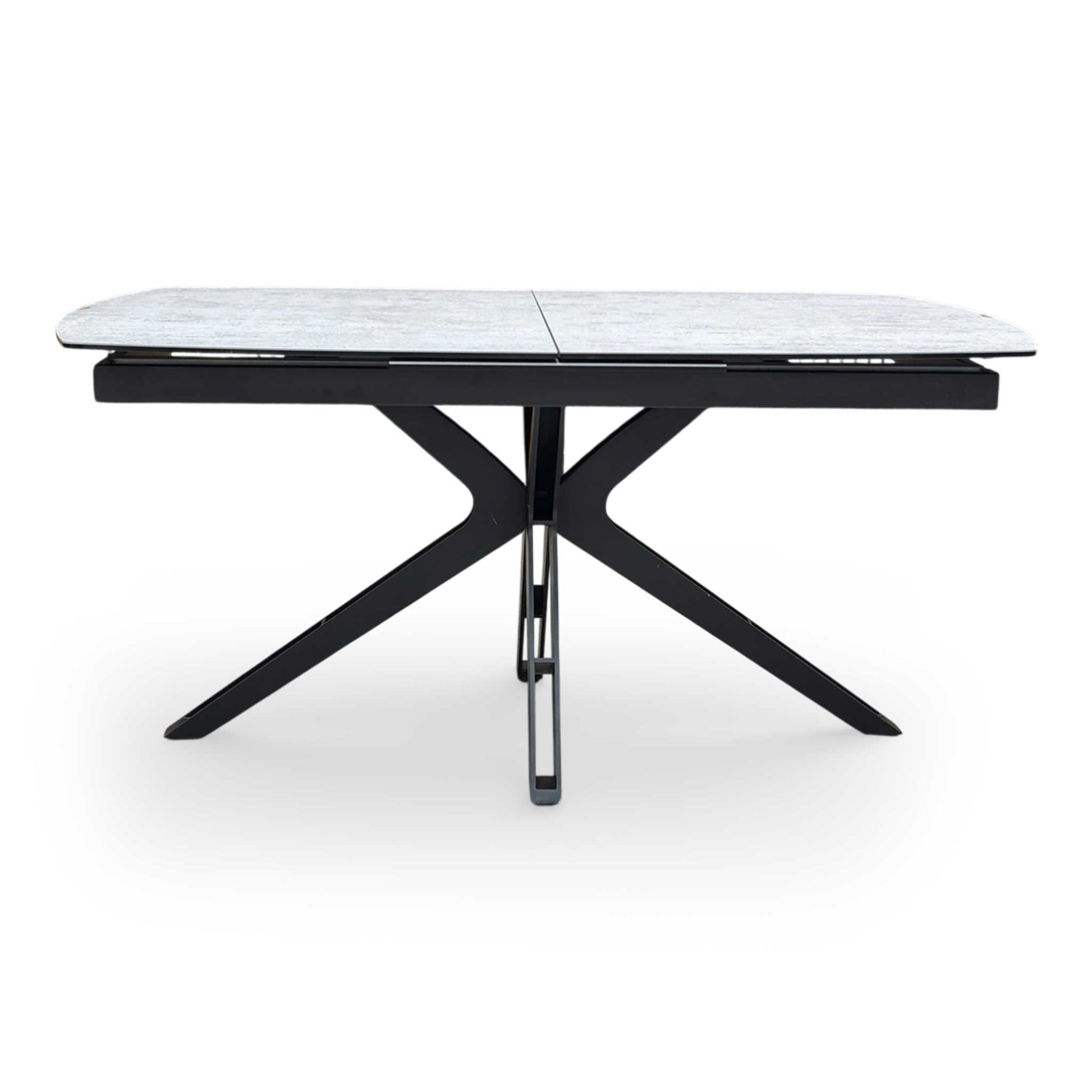 Front view of highlighting the elegant curved boat-shaped edges of the silver ceramic dining table.