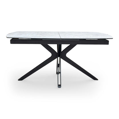 Front view of highlighting the elegant curved boat-shaped edges of the silver ceramic dining table.
