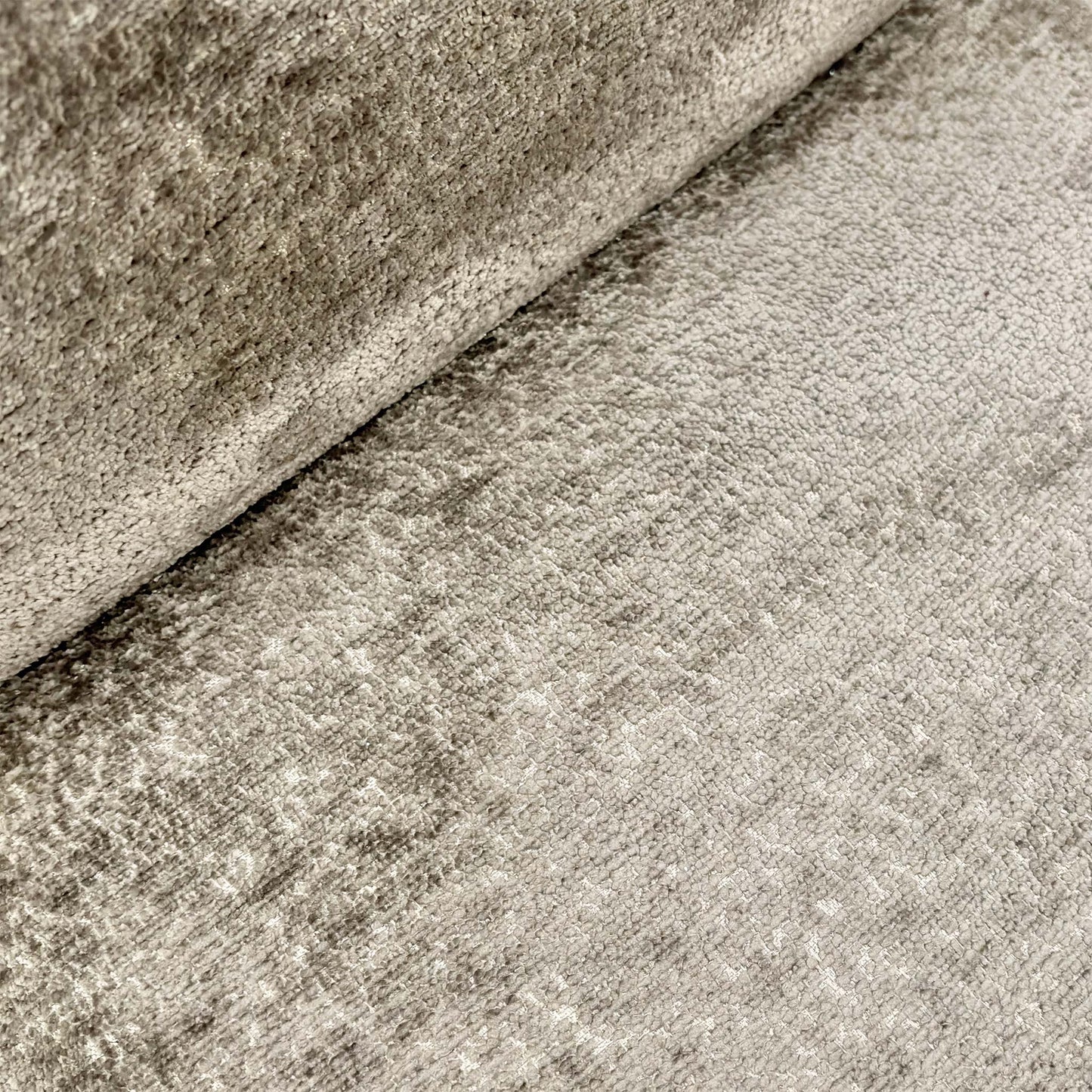 Close-up of the chair’s backrest, highlighting the central horizontal groove and elegant pinched seam stitching along the edges.