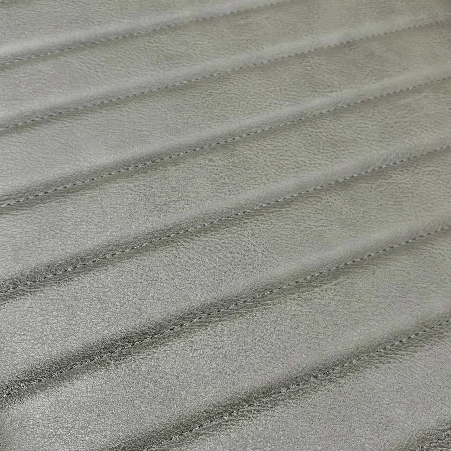 Close-up of the grey padded bench cushion, highlighting the textured fabric that adds comfort to the solid oak seat.