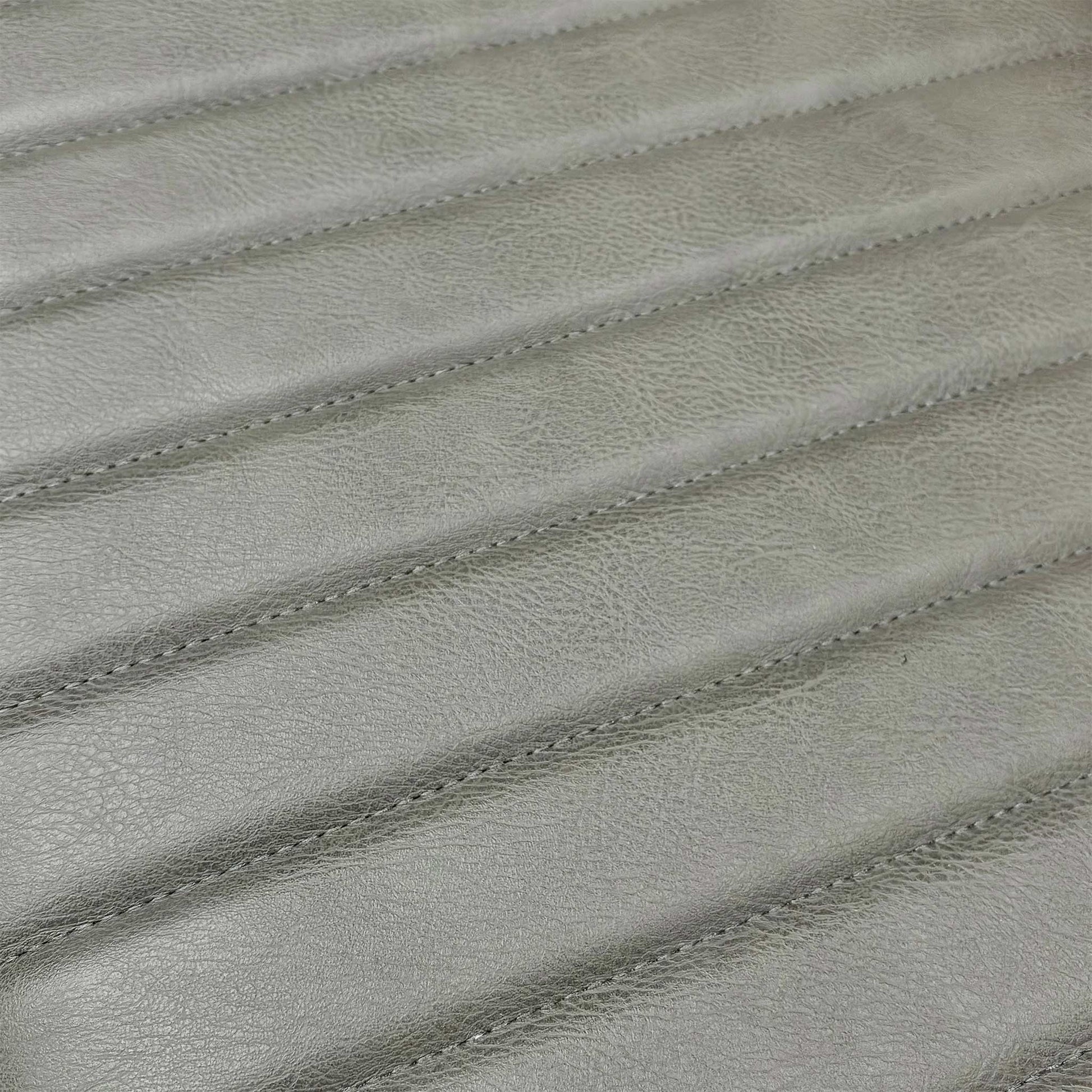 Close-up of the grey padded bench cushion, highlighting the textured fabric that adds comfort to the solid oak seat.