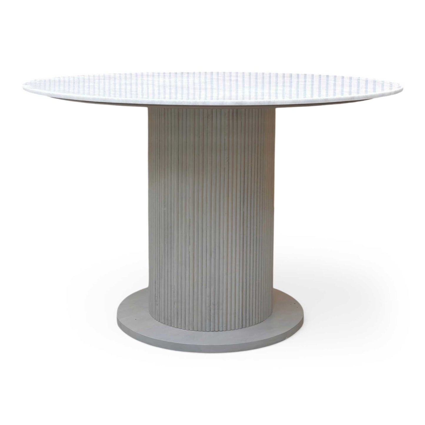 Side profile of the Aimar table, emphasizing the slim, contemporary profile of the ceramic-on-glass top and the architectural base.