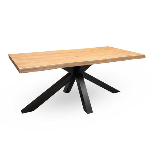Full view of the Saturn solid oak dining table, showcasing its large 180cm fixed length, striking live edge borders, and organic, natural aesthetic.