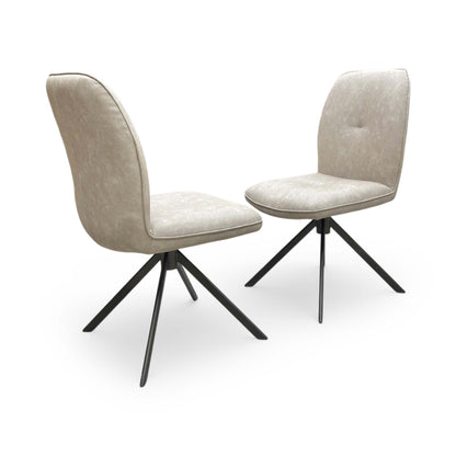 Full view of Set of two Perla neutral upholstered dining chairs featuring a stone fabric finish and dark bronze metal legs.