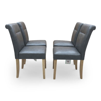 Frontal view of the Lewis chair emphasizing the high roll-back silhouette and foam-padded seat.