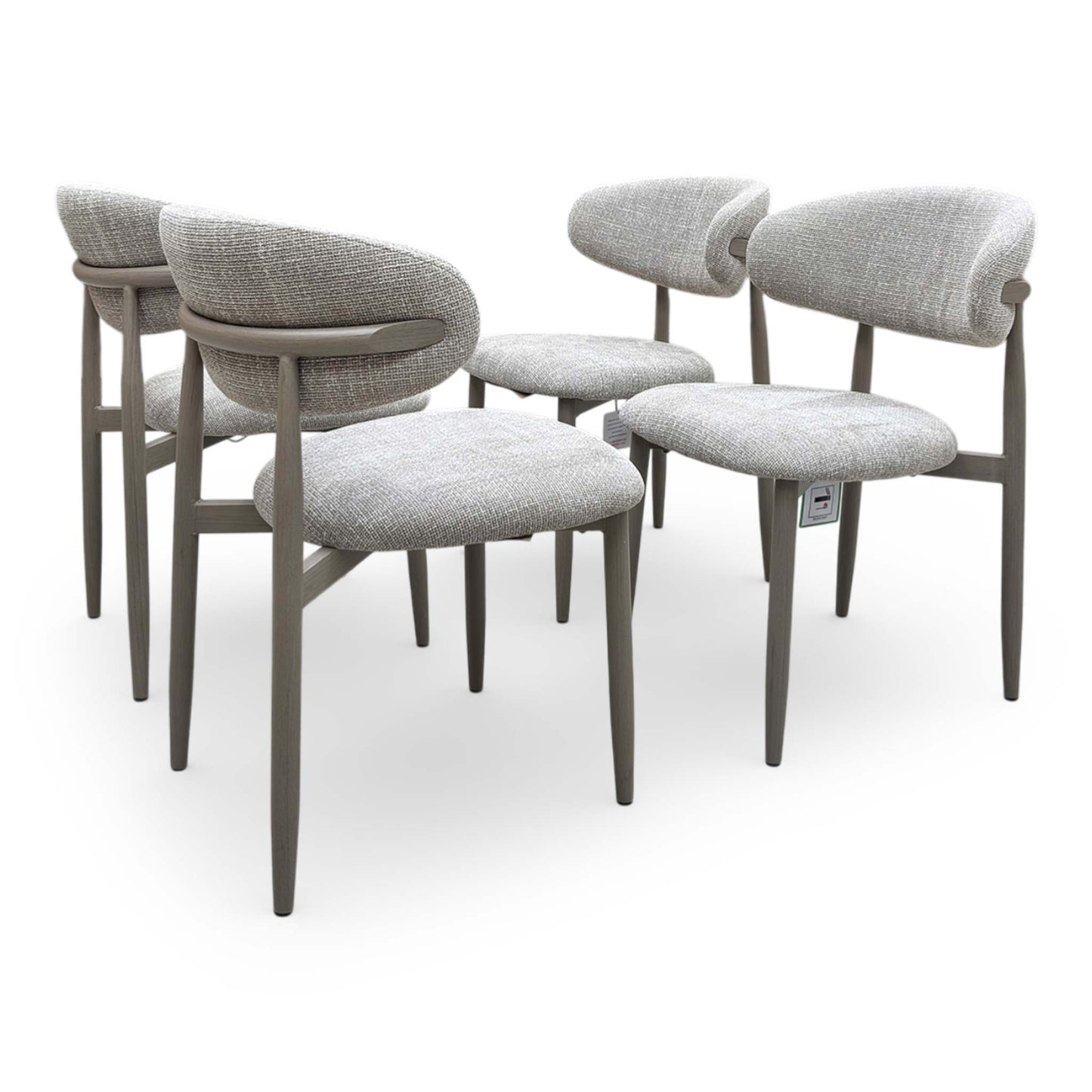 A side shot of the Aimar oatmeal chair showing the ergonomic wrap-around backrest and padded seat.