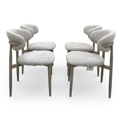 Front view of Set of four Aimar dining chairs in oatmeal fabric, featuring a curved open-back design and dark wood legs.