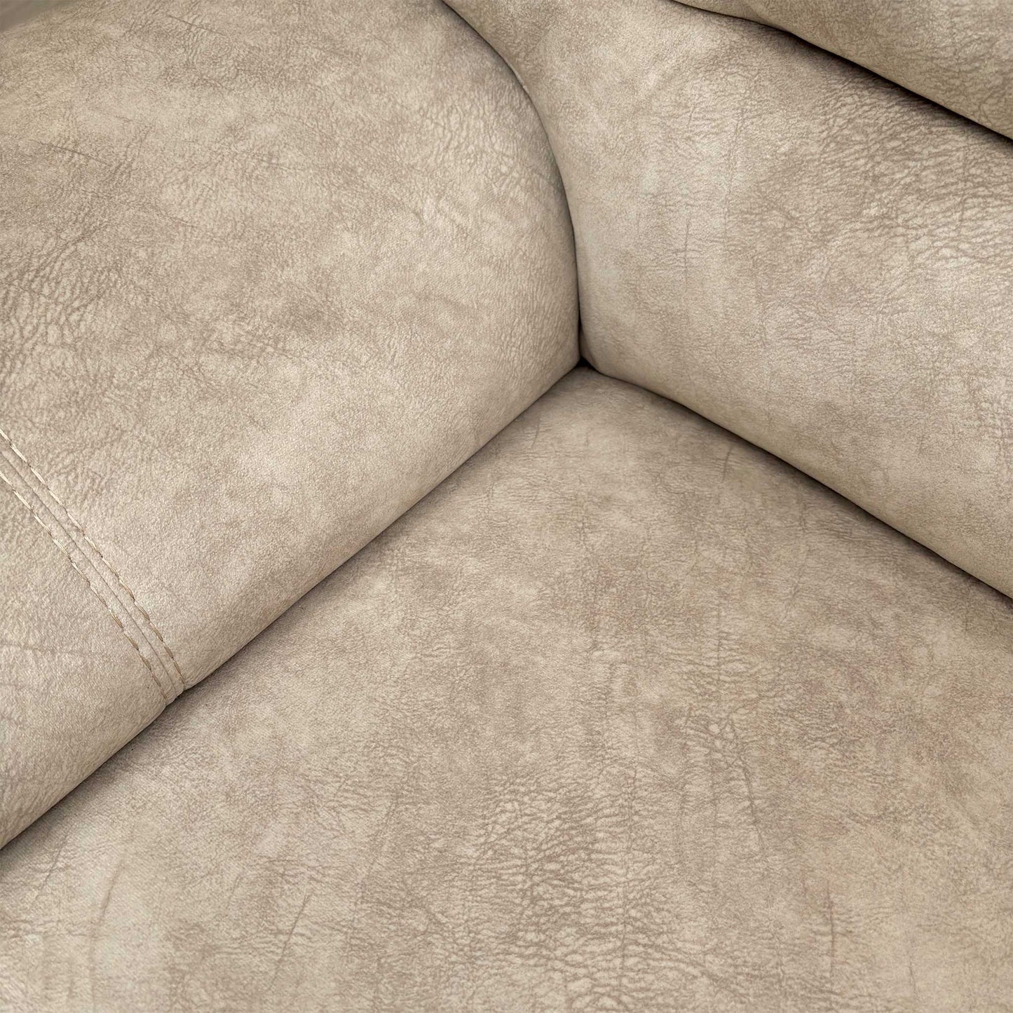 Close-up of the plush cream velvet fabric, illustrating the soft texture and premium finish of the sofa's upholstery.