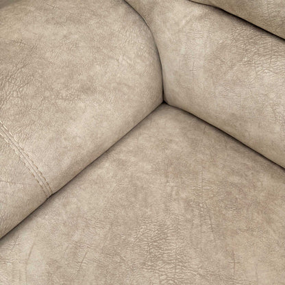 Close-up of the plush cream velvet fabric, illustrating the soft texture and premium finish of the sofa's upholstery.