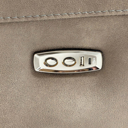 Detailed view of the integrated power recliner controls and USB charging port on the side of the armrest.