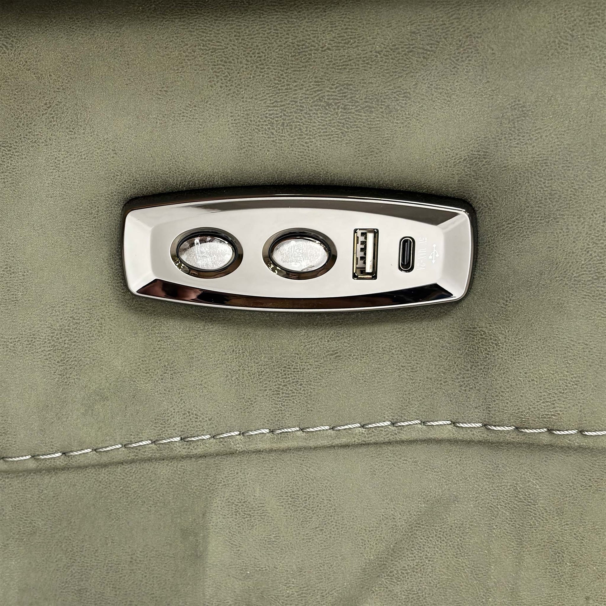 Close up view of the integrated power controls on the sofa arm, featuring the reclining buttons and a built-in USB port for convenient device charging.