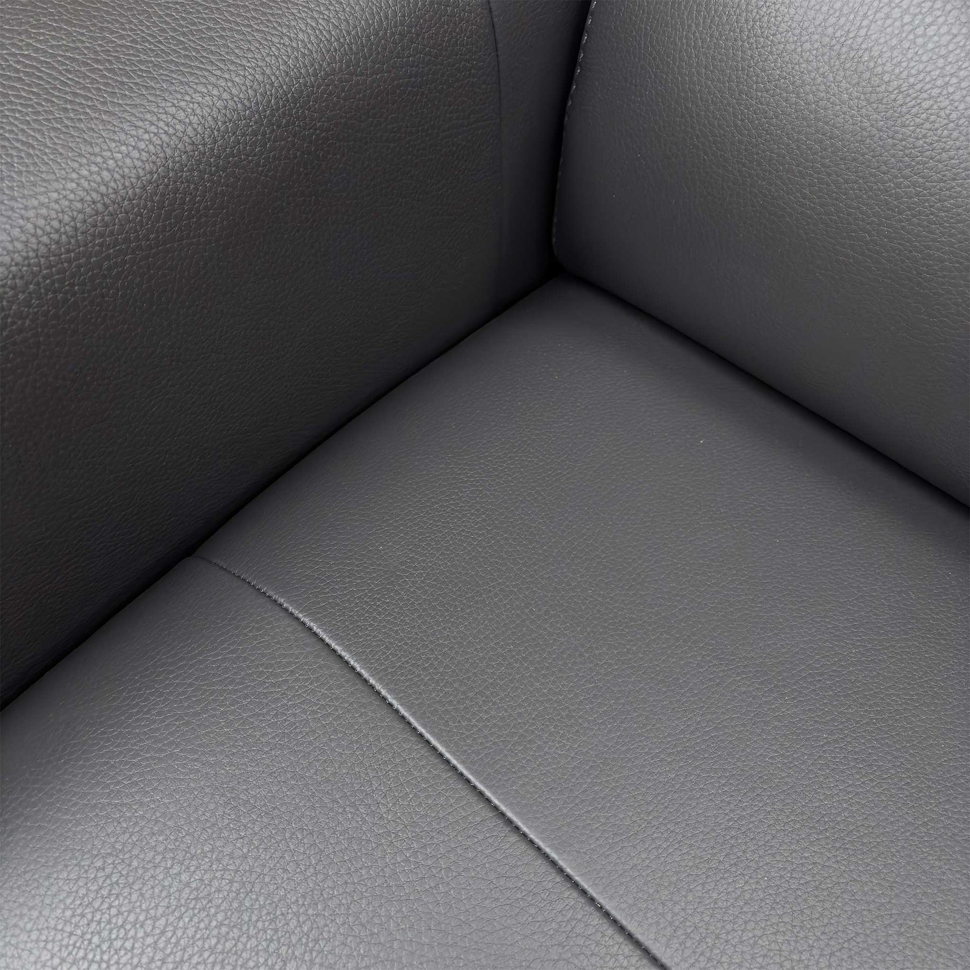 Close-up of the Cat-50 leather upholstery in Medium Grey, highlighting the soft-touch yet resilient texture of the premium hide.