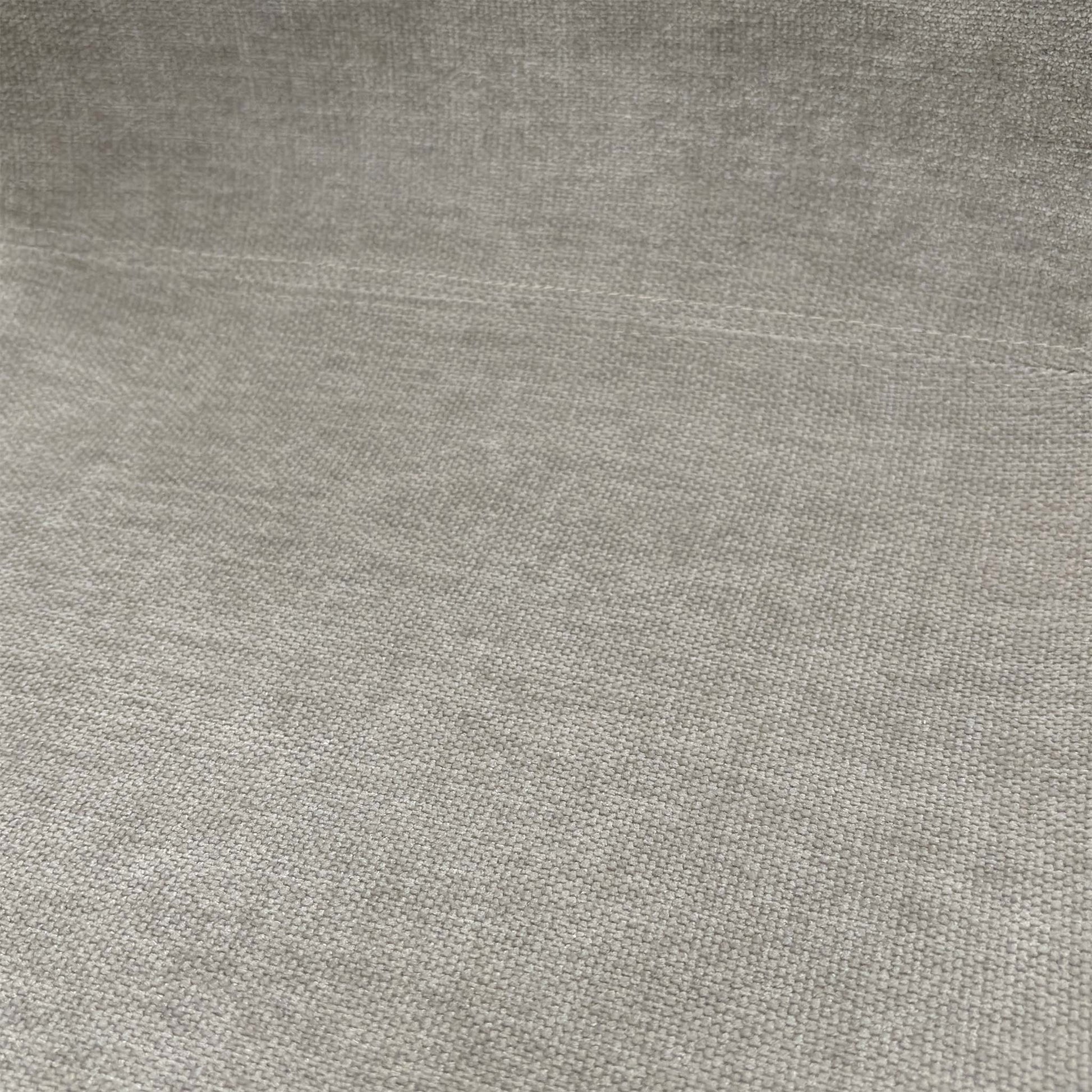 Close-up shot of the grey upholstery and solid oak wooden leg joinery, emphasizing the high-quality materials and foam cushioning.