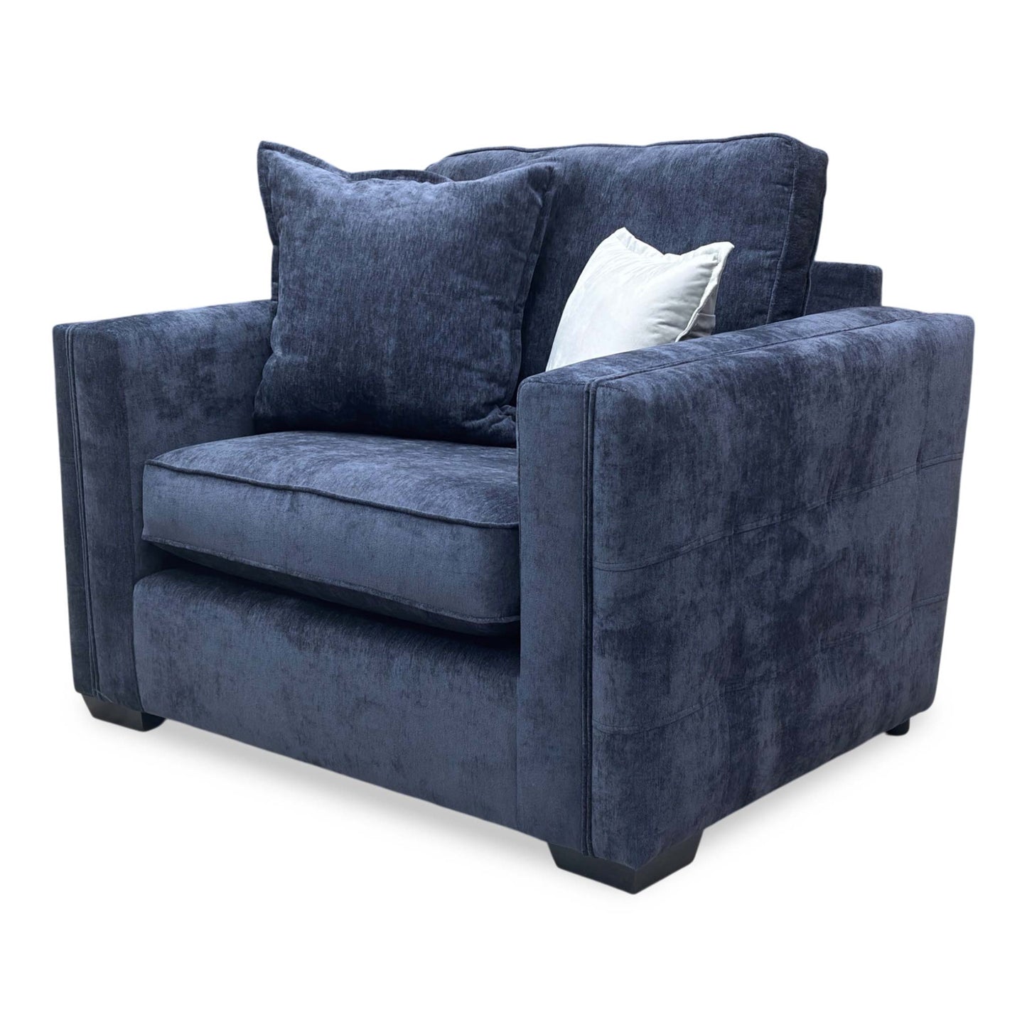Side profile of the Chelsea love chair, showcasing the depth of the seat and the classic back cushion profile.