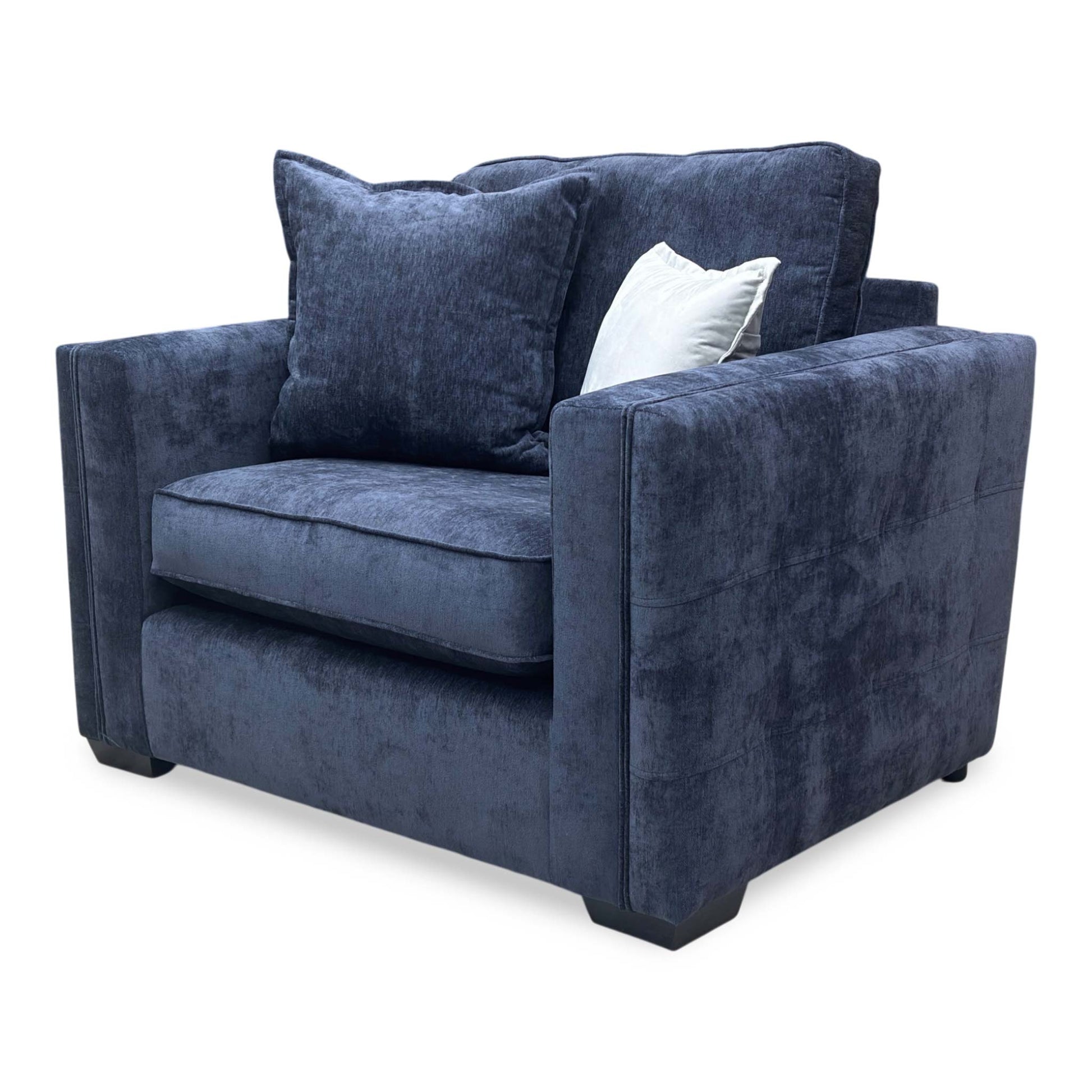 Side profile of the Chelsea love chair, showcasing the depth of the seat and the classic back cushion profile.