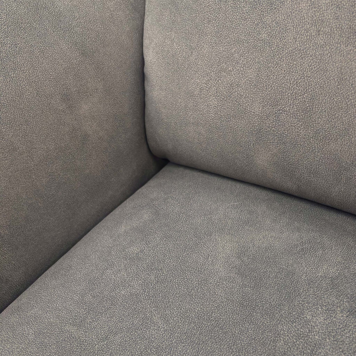 Close-up of the Dexter mocha grey fabric, showing the soft-touch weave and detailed geometric stitching patterns.