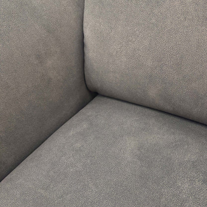 Close-up of the Dexter mocha grey fabric, showing the soft-touch weave and detailed geometric stitching patterns.